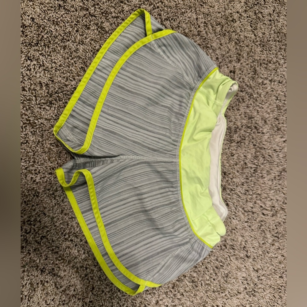 Gray with yellow stitching and waistband Lululemon shorts